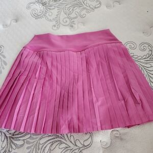 Tennis skirt with short and pockets. Size M. Never worn